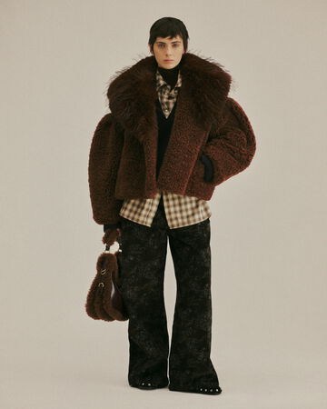 Model wearing a brown fur coat from the Fall/Winter 2026 collection